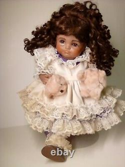 18 Porcelain African American Doll with broken puppy. Roman c502