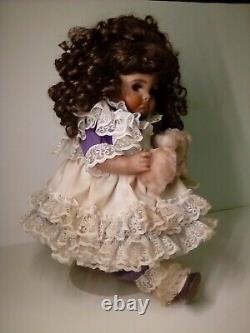 18 Porcelain African American Doll with broken puppy. Roman c502