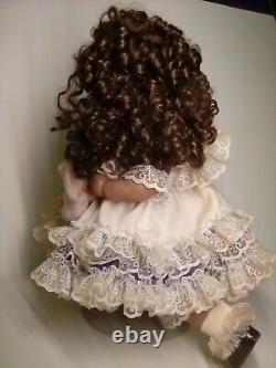 18 Porcelain African American Doll with broken puppy. Roman c502