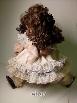 18 Porcelain African American Doll with broken puppy. Roman c502