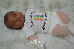 AA ethnic reborn baby cloth body ooak doll. Extremely poseable