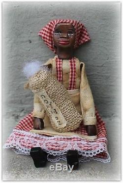 Hand carved African american hitty doll