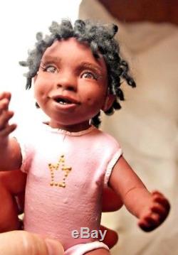 OOAK African American baby girl doll by ALMA Artistry. Polymer clay sculpture